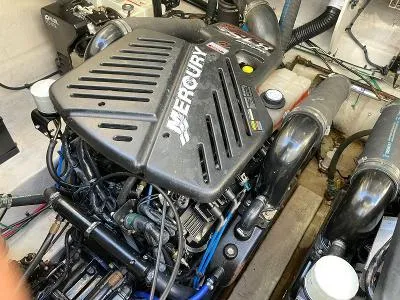 Slide: The Image of Engine compartment of a 2005 Sea Ray 340 Sundancer with Mercury engine. - 16