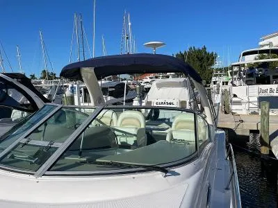 Slide: The Image of 2005 Sea Ray 340 Sundancer docked at marina, blue sky. - 21