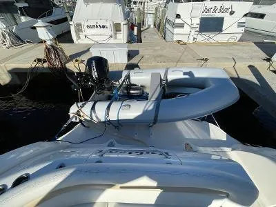 Slide: The Image of 2005 Sea Ray 340 Sundancer with dinghy at the dock. - 36