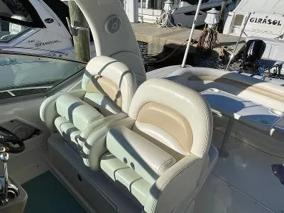Slide: The Image of Interior of a 2005 Sea Ray 340 Sundancer boat with beige seats. - 4
