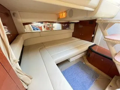 Slide: The Image of Interior of 2005 Sea Ray 340 Sundancer with beige sofa and carpet. - 43