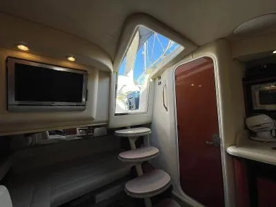 Slide: The Image of Interior of 2005 Sea Ray 340 Sundancer with stairs and TV. - 44