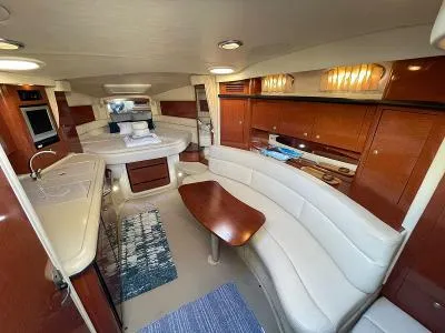 Slide: The Image of Interior of a 2005 Sea Ray 340 Sundancer yacht with elegant furnishings. - 46
