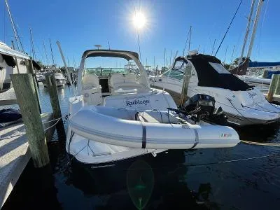 Slide: The Image of 2005 Sea Ray 340 Sundancer docked with dinghy. - 48