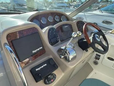 Slide: The Image of 2005 Sea Ray 340 Sundancer helm with Raymarine equipment. - 5