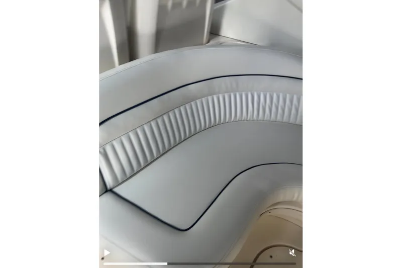 Slide: The Image of White leather seating on 2005 Sea Ray 340 Sundancer boat, featuring elegant stitching. - 67