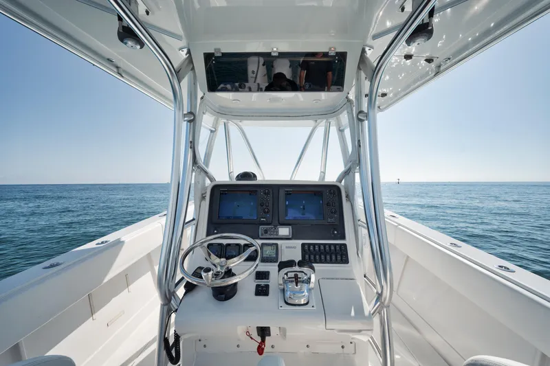 Slide: The Image of Center console of a 2010 Jupiter 38 CC boat with ocean view. - 10