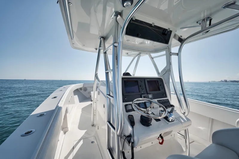 Slide: The Image of Center console of 2010 Jupiter 38 CC boat on open water. - 17