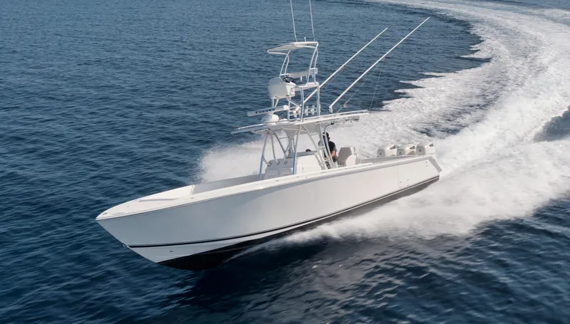 Slide: The Image of Jupiter 38 CC 2010 boat cruising swiftly on open water. - 3