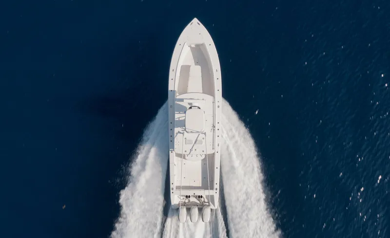 Slide: The Image of Aerial view of 2010 Jupiter 38 CC boat cruising on blue ocean water. - 4