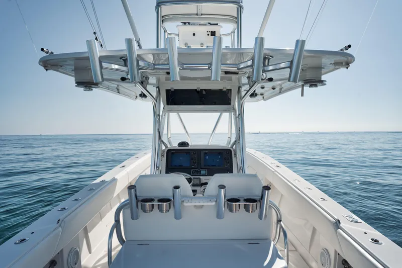 Slide: The Image of 2010 Jupiter 38 CC boat dashboard with ocean view, featuring modern navigation equipment. - 9