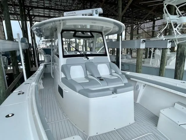 Slide: The Image of 2020 Regulator 41 boat with dual seating in a marina. - 12