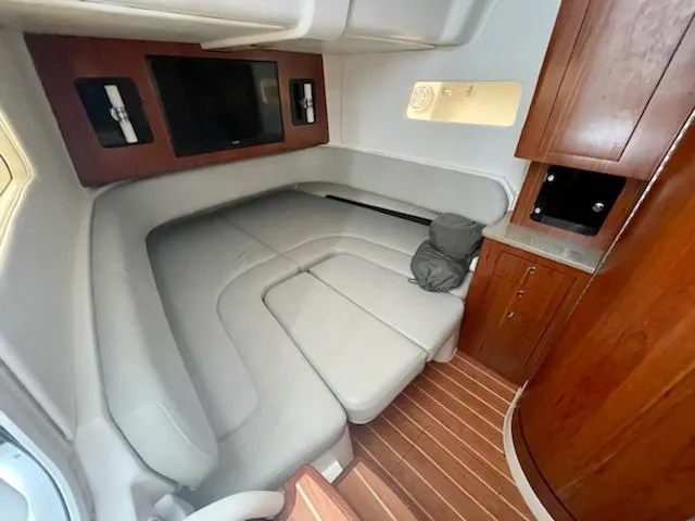 Slide: The Image of Luxurious interior cabin of 2020 Regulator 41 boat with leather seating and wooden cabinetry. - 20