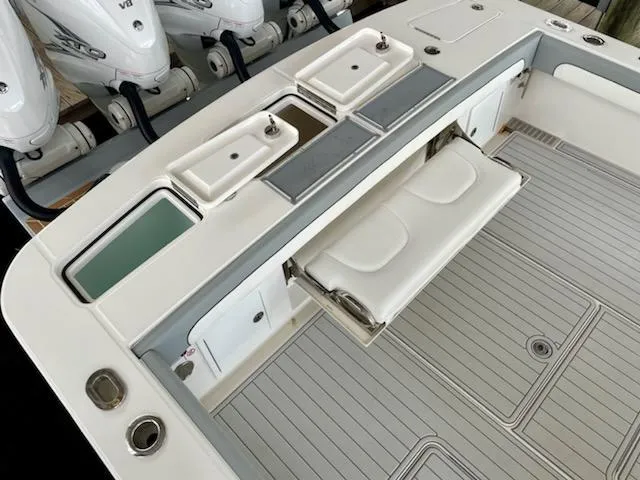 Slide: The Image of 2020 Regulator 41 boat deck with seating and storage compartments. - 5