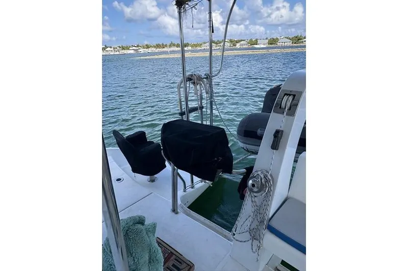 Slide: The Image of 1998 Leopard Catamaran deck view with ocean backdrop and clear skies. - 10