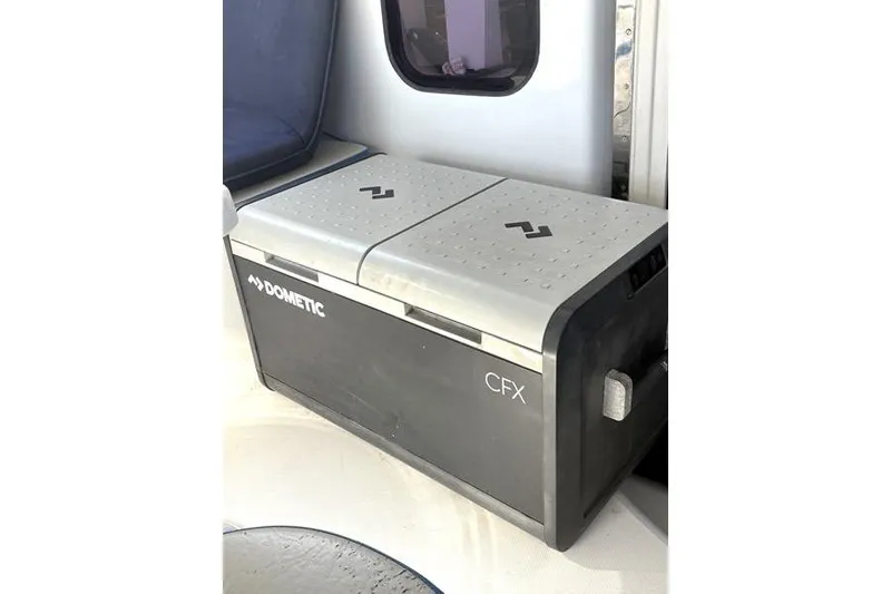 Slide: The Image of Dometic CFX cooler on a 1998 Leopard Catamaran, positioned near a window. - 18