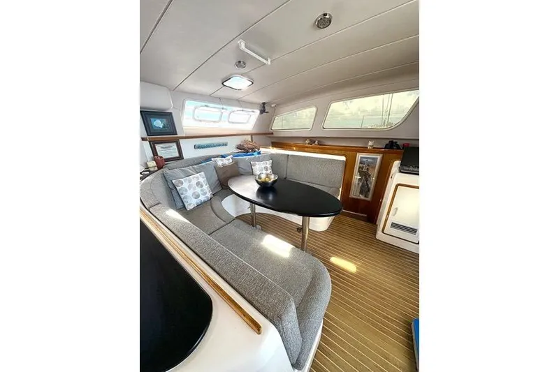 Slide: The Image of Interior of a 1998 Leopard Catamaran with cozy seating and modern decor. - 21