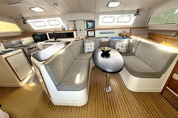 Slide: The Image of Spacious interior of a 1998 Leopard Catamaran with modern kitchen and cozy seating area. - 24