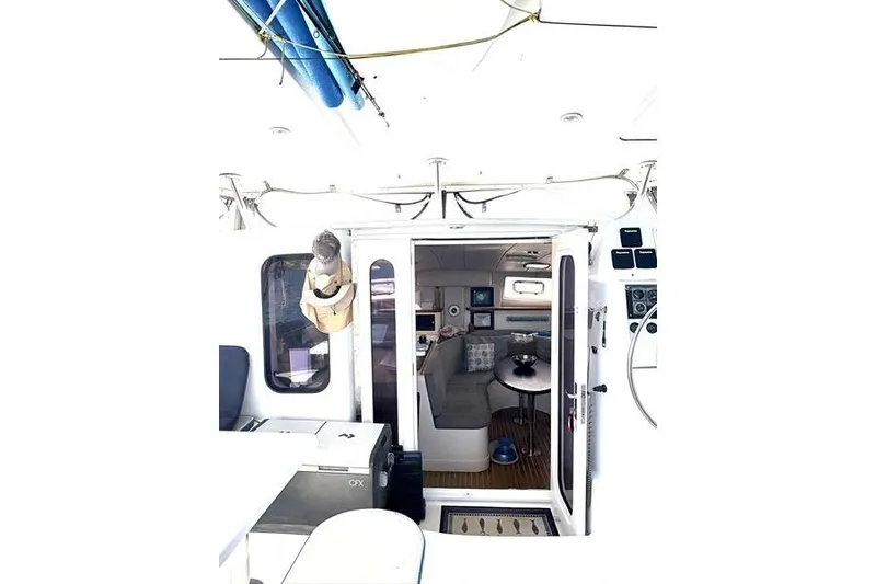 Slide: The Image of Interior view of a 1998 Leopard Catamaran, showcasing seating and navigation area. - 31