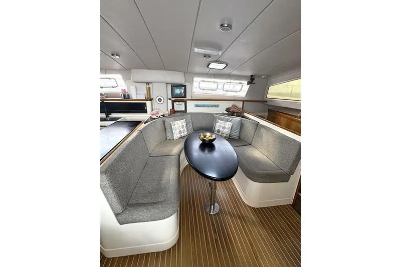 Slide: The Image of Interior of 1998 Leopard Catamaran with cozy seating and modern decor. - 33