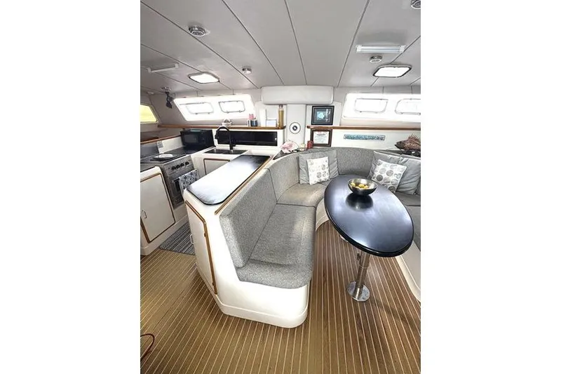 Slide: The Image of Interior of a 1998 Leopard Catamaran with modern kitchen and cozy seating area. - 34