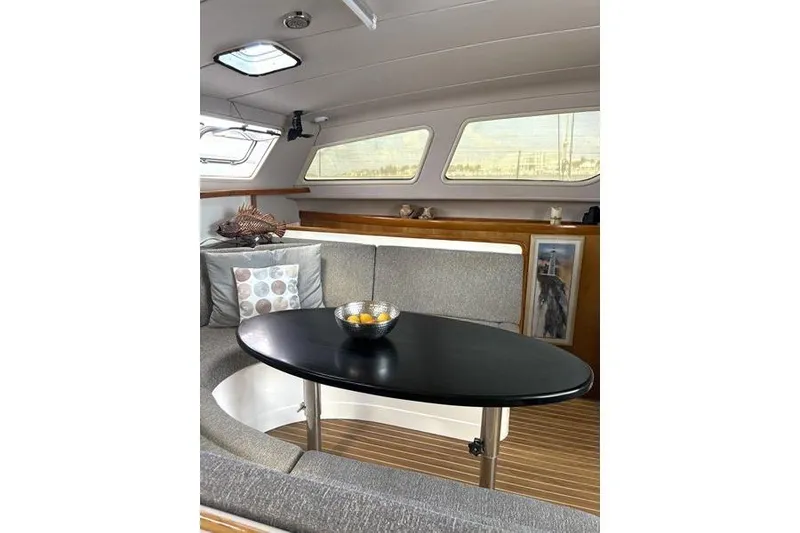 Slide: The Image of Interior of 1998 Leopard Catamaran with cozy seating and modern table. - 35
