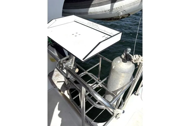 Slide: The Image of 1998 Leopard Catamaran with mounted scuba tank and stainless steel grill holder. - 37