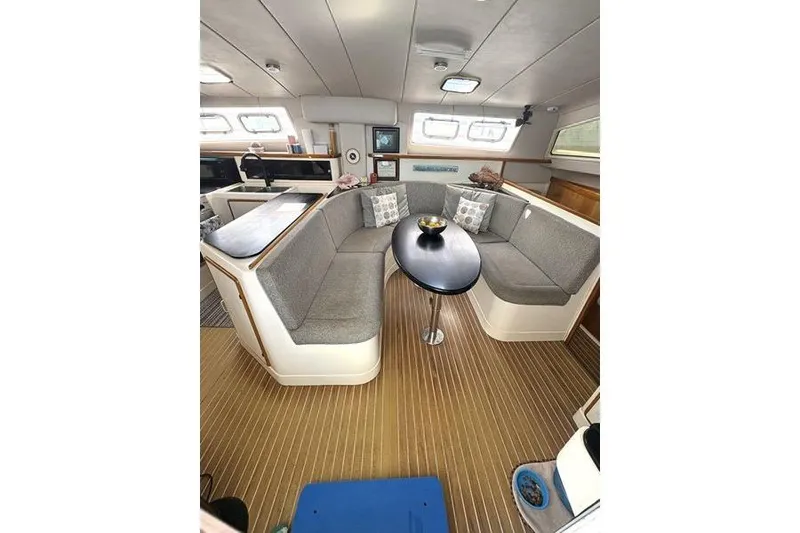 Slide: The Image of Interior of a 1998 Leopard Catamaran with cozy seating and modern decor. - 39