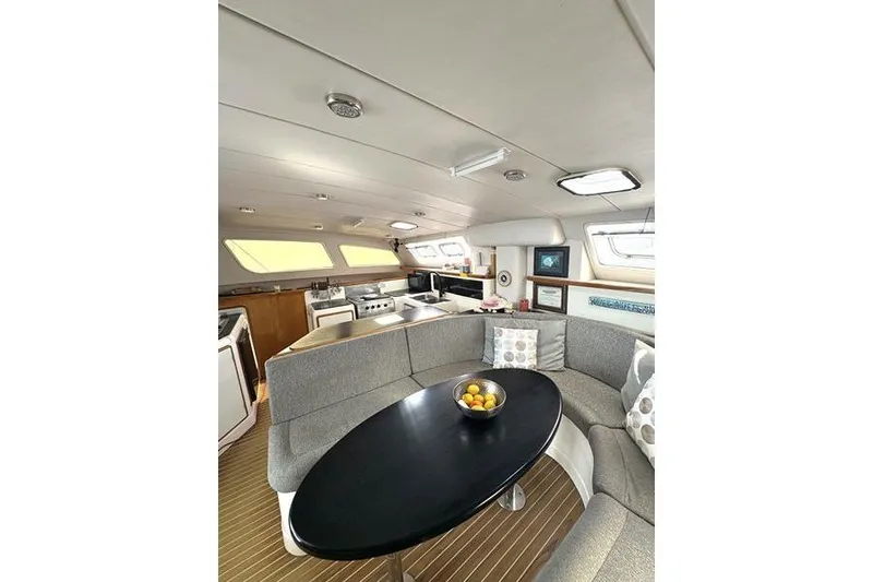 Slide: The Image of Interior of a 1998 Leopard Catamaran with modern kitchen and cozy seating area. - 41