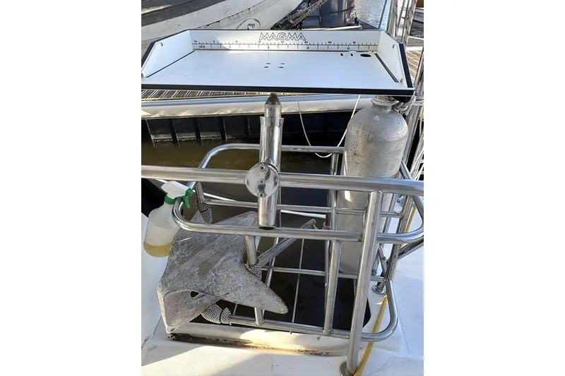 Slide: The Image of 1998 Leopard Catamaran deck with anchor and scuba tank. - 59