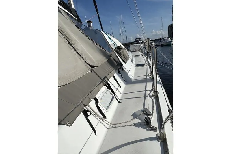 Slide: The Image of 1998 Leopard Catamaran docked, showcasing deck and rigging details. - 60
