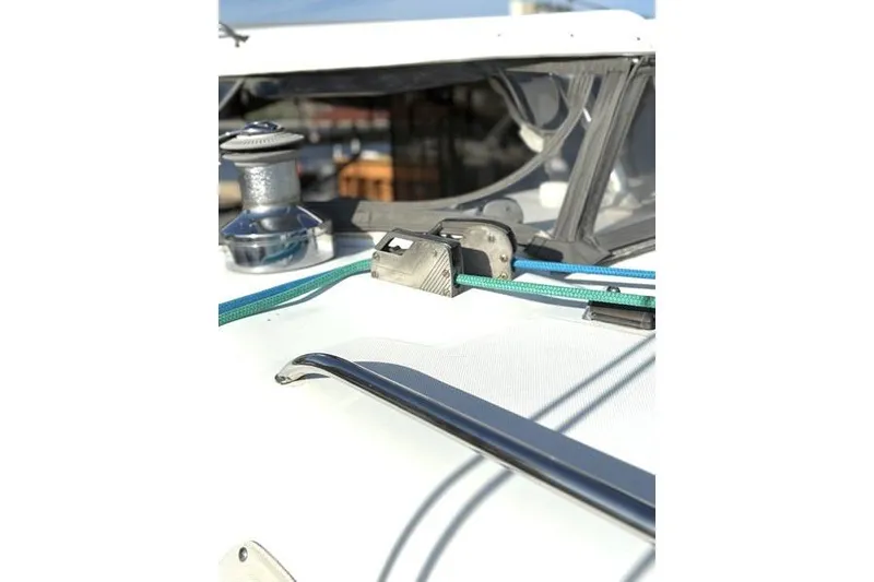Slide: The Image of Close-up of 1998 Leopard Catamaran deck with winch and ropes. - 64