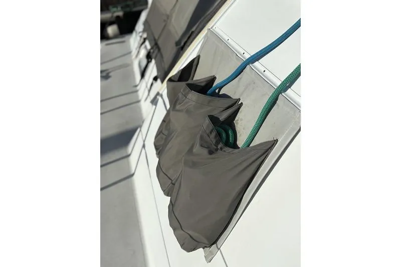 Slide: The Image of Storage bags with ropes on a 1998 Leopard Catamaran deck. - 65