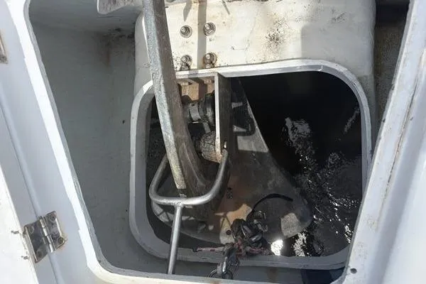 Slide: The Image of Anchor compartment of a 1998 Leopard Catamaran, showing anchor and chain storage. - 70