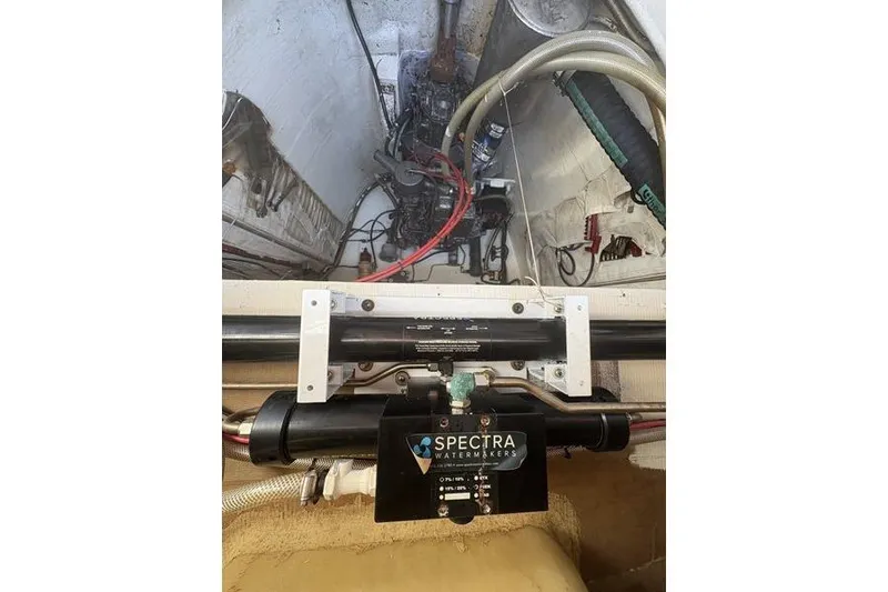 Slide: The Image of Engine compartment of a 1998 Leopard Catamaran featuring a Spectra watermaker system. - 81