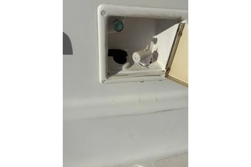 Slide: The Image of 1998 Leopard Catamaran compartment with open hatch and visible fittings. - 84