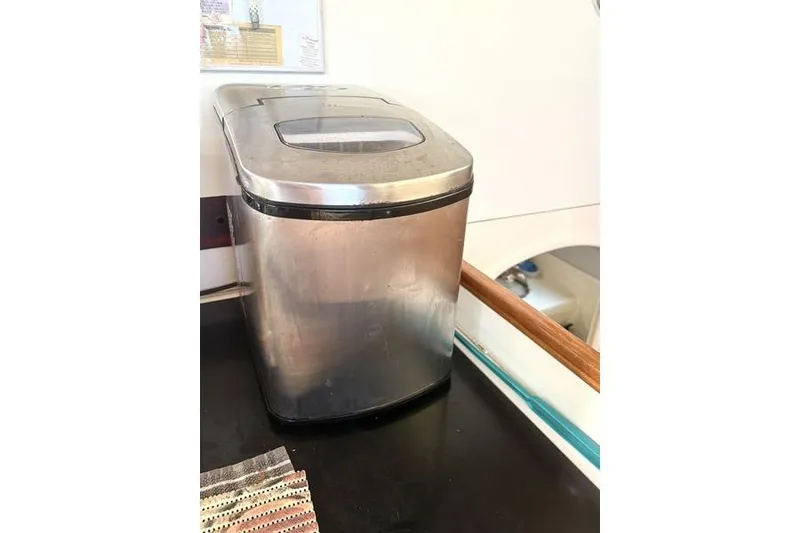 Slide: The Image of Stainless steel ice maker on Leopard Catamaran, 1998 model, kitchen interior. - 89