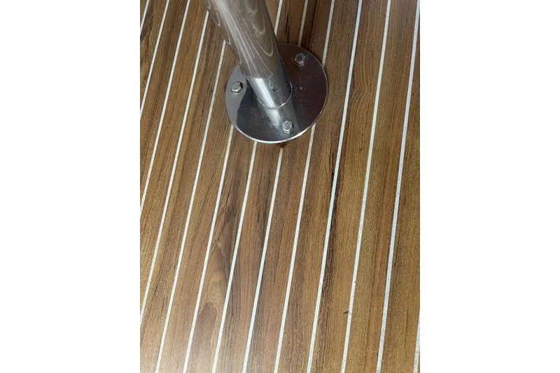 Slide: The Image of Teak deck with metal pole on 1998 Leopard Catamaran. - 92