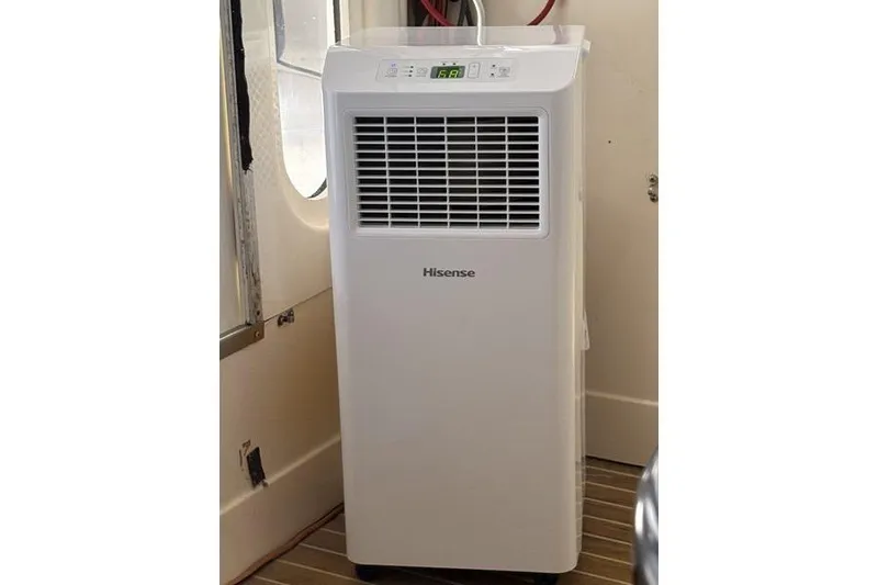 Slide: The Image of Portable Hisense air conditioner inside a 1998 Leopard Catamaran, providing efficient cooling. - 95