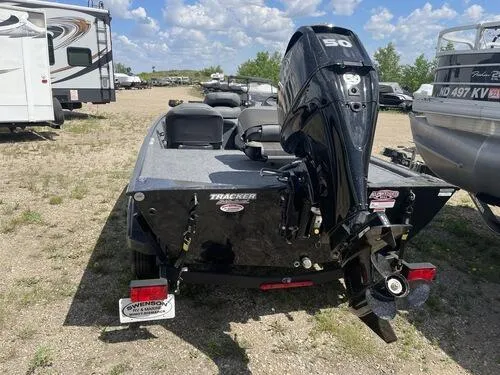 Slide: The Image of 2022 Tracker Bass Tracker Classic XL boat with 50 HP motor, parked outdoors. - 3