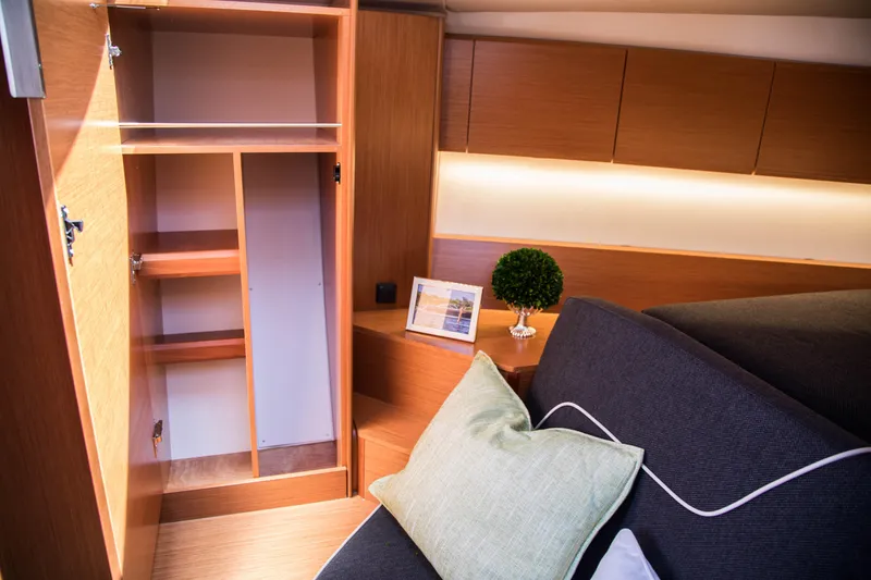 Slide: The Image of Interior of 2023 Keizer 42 yacht with open closet and cozy seating area. - 23