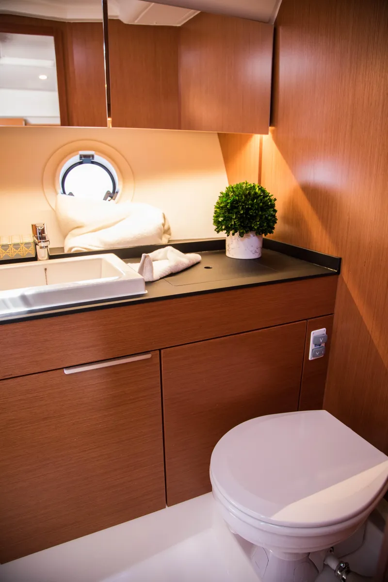 Slide: The Image of Modern bathroom in 2023 Keizer 42 yacht with wooden cabinetry and porthole. - 32