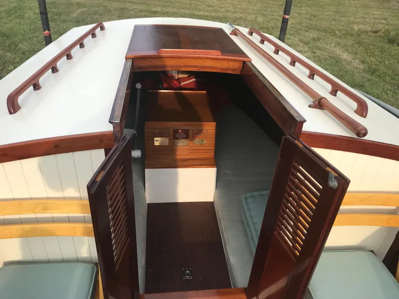 Slide: The Image of Classic 2002 Jesperson/Zimmer Design boat interior with wooden accents and open cabin doors. - 12