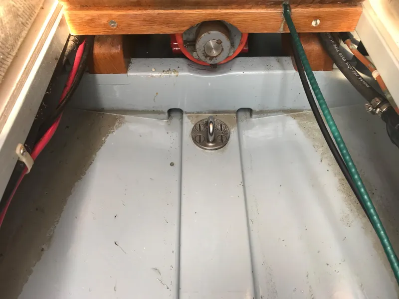 Slide: The Image of Interior view of a 2002 Classic Jesperson/Zimmer Design boat showing wiring and drainage. - 16