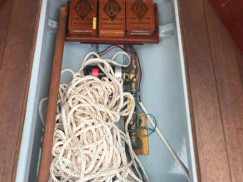 Slide: The Image of Coiled rope and equipment inside a 2002 Classic Jesperson/Zimmer Design boat compartment. - 18