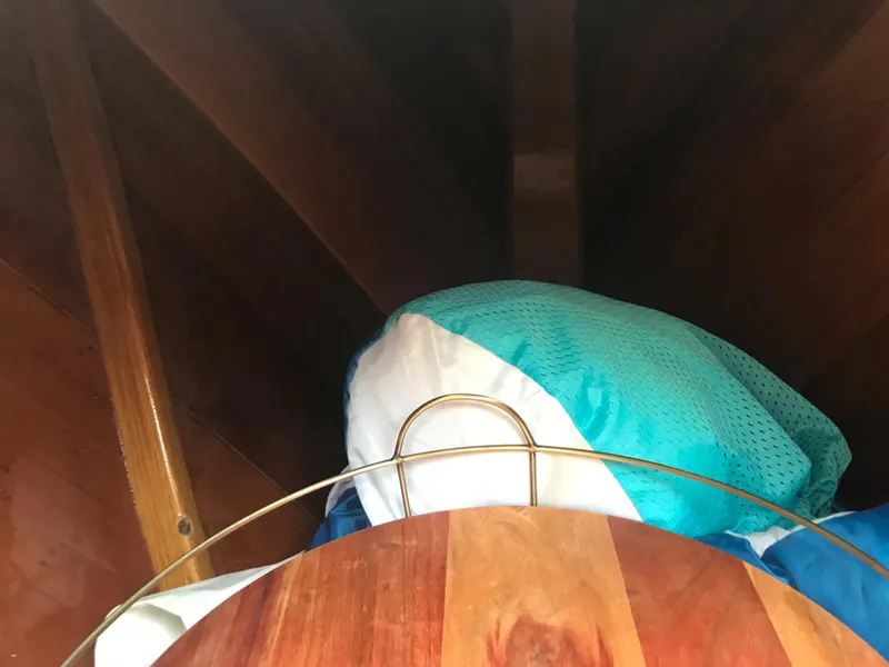 Slide: The Image of Wooden interior of a 2002 Classic Jesperson/Zimmer Design boat with colorful cushions. - 19