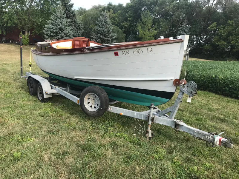 Slide: The Image of Classic 2002 Jesperson/Zimmer Design boat on trailer, parked on grassy field. - 2