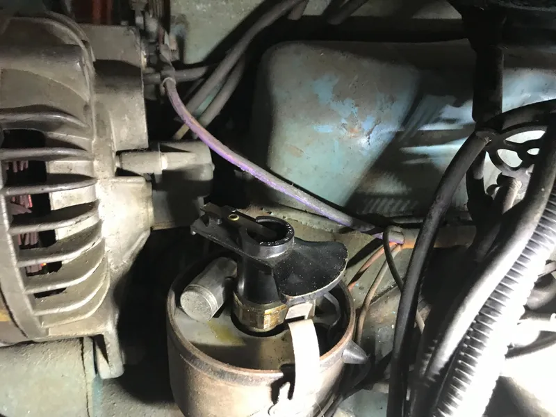 Slide: The Image of Close-up of a 2002 Classic Jesperson/Zimmer engine component with visible wiring and alternator. - 24