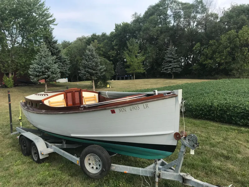 Slide: The Image of Classic 2002 Jesperson/Zimmer Design boat on trailer, surrounded by lush greenery. - 3