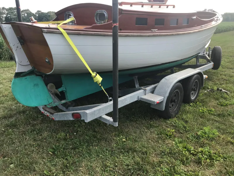 Slide: The Image of Classic 2002 Jesperson/Zimmer Design boat on trailer, parked on grassy field. - 6